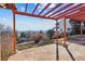 Relaxing back patio with stone floors, pergola and mountain views at 8258 W 66Th Dr, Arvada, CO 80004