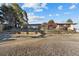 View of the backyard, exterior and terraced hill at 8258 W 66Th Dr, Arvada, CO 80004