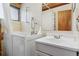 Accessible bathroom featuring walk-in tub, shower, and modern fixtures at 8258 W 66Th Dr, Arvada, CO 80004