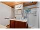 Updated bathroom boasts modern fixtures, a walk-in shower, and a sleek vanity at 8258 W 66Th Dr, Arvada, CO 80004