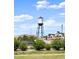 A neighborhood with residential buildings is shown with landscaping and the Arvada Water Tower at 8258 W 66Th Dr, Arvada, CO 80004