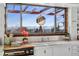 A charming kitchen sink with a view, this space is bathed in natural light and complemented by vintage appliances at 8258 W 66Th Dr, Arvada, CO 80004