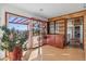 A charming living room displays unique shelving, abundant natural light, and access to an outdoor patio at 8258 W 66Th Dr, Arvada, CO 80004