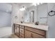 Bathroom features double vanity with granite counters, providing ample space at 16774 W 93Rd Pl, Arvada, CO 80007