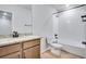 Bathroom has single vanity with granite counters, toilet and shower/tub combo at 16774 W 93Rd Pl, Arvada, CO 80007