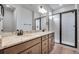 Beautiful bathroom with a double vanity, granite counters, and a glass-enclosed shower at 16774 W 93Rd Pl, Arvada, CO 80007