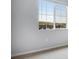 Bright bedroom featuring a window offering neighborhood views and neutral walls at 16774 W 93Rd Pl, Arvada, CO 80007