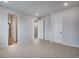 Spacious carpeted bedroom with ensuite access, neutral paint, and recessed lighting at 16774 W 93Rd Pl, Arvada, CO 80007