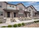 Charming townhomes featuring board and batten siding and inviting covered front porches, perfect for relaxation at 16774 W 93Rd Pl, Arvada, CO 80007