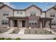 Charming townhomes featuring board and batten siding and inviting covered front porches, perfect for relaxation at 16774 W 93Rd Pl, Arvada, CO 80007