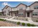Charming townhomes featuring board and batten siding and inviting covered front porches, perfect for relaxation at 16774 W 93Rd Pl, Arvada, CO 80007
