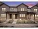 Charming townhomes featuring board and batten siding and inviting covered front porches, great for enjoying peaceful evenings at 16774 W 93Rd Pl, Arvada, CO 80007