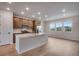 Contemporary kitchen with stainless steel appliances and a spacious center island at 16774 W 93Rd Pl, Arvada, CO 80007