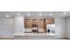 Modern kitchen features a large center island and stainless steel appliances at 16774 W 93Rd Pl, Arvada, CO 80007