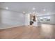 Spacious living room and kitchen combo with wood floors and lots of natural light from the large windows at 16774 W 93Rd Pl, Arvada, CO 80007