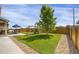 Well-maintained backyard features a lush lawn, playground, dining area, and privacy fence at 17052 Lipan St, Broomfield, CO 80023