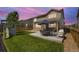 Landscaped backyard featuring a patio, lawn, and playground, perfect for outdoor enjoyment at 17052 Lipan St, Broomfield, CO 80023