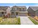 Beautiful two-story home featuring a well-maintained lawn and a welcoming facade at 17052 Lipan St, Broomfield, CO 80023