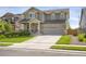 Inviting two-story home with a spacious driveway and beautifully landscaped front yard at 17052 Lipan St, Broomfield, CO 80023