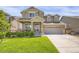 Charming two-story home with a well-manicured lawn and inviting front porch at 17052 Lipan St, Broomfield, CO 80023