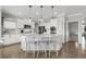 Bright kitchen with stainless steel appliances, granite counters, and island with seating at 17052 Lipan St, Broomfield, CO 80023