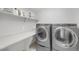 Laundry room with side-by-side washer and dryer at 17052 Lipan St, Broomfield, CO 80023