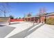 Snowy backyard with covered patio and storage shed at 12152 E Dakota Ave, Aurora, CO 80012