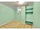 Basement bedroom with built-in shelving and a window at 12152 E Dakota Ave, Aurora, CO 80012