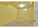 Simple basement bedroom with neutral walls and carpet at 12152 E Dakota Ave, Aurora, CO 80012