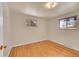 Spacious bedroom with hardwood floors and two windows at 12152 E Dakota Ave, Aurora, CO 80012