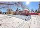 Brick ranch home with snow-covered yard at 12152 E Dakota Ave, Aurora, CO 80012