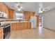 Kitchen with wood cabinets and stainless steel appliances at 12152 E Dakota Ave, Aurora, CO 80012