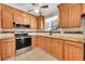 Kitchen with wood cabinets, granite counters at 12152 E Dakota Ave, Aurora, CO 80012