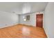 Living room with hardwood floors and door at 12152 E Dakota Ave, Aurora, CO 80012