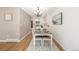 Dining room adjacent to kitchen features hardwood floors, seating for four, and modern lighting at 1922 Lydia Dr # 82, Lafayette, CO 80026