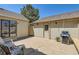 Backyard with an outdoor seating area, grill, and tidy landscaping perfect for entertaining at 9925 W Progress Pl, Littleton, CO 80123