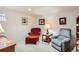 A cozy seating area in a finished basement with carpet at 9925 W Progress Pl, Littleton, CO 80123