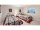 Finished basement bedroom featuring 2 twin beds with patterned bedding and a window at 9925 W Progress Pl, Littleton, CO 80123