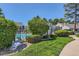 Landscaped community pool featuring lush greenery, and well-manicured lawns providing an inviting retreat for residents at 9925 W Progress Pl, Littleton, CO 80123