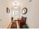 Welcoming foyer with hardwood floors, a decorative mirror, and a wooden bench at 9925 W Progress Pl, Littleton, CO 80123