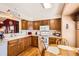 Functional kitchen with hardwood floors and ample counter space at 9925 W Progress Pl, Littleton, CO 80123