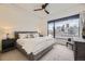 Inviting bedroom showcasing a large window with stunning city views and neutral decor at 1750 Wewatta St # 704, Denver, CO 80202