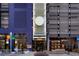 Modern commercial building featuring stylish storefronts and pedestrian-friendly walkways at 1750 Wewatta St # 704, Denver, CO 80202