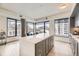 Modern kitchen with a large island, stainless steel appliances, and city views at 1750 Wewatta St # 704, Denver, CO 80202