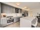Well-appointed kitchen featuring stainless steel appliances, light gray cabinetry, and ample counter space at 1750 Wewatta St # 704, Denver, CO 80202