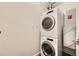 Efficient stacked washer and dryer in a dedicated laundry area at 1750 Wewatta St # 704, Denver, CO 80202