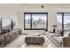 Bright living room with cityscape views, comfortable seating, and stylish furnishings at 1750 Wewatta St # 704, Denver, CO 80202