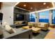 Cozy living room with a fireplace and large windows overlooking the city at 1750 Wewatta St # 704, Denver, CO 80202