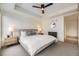 Comfortable bedroom with a ceiling fan, modern decor, and neutral colors at 1750 Wewatta St # 704, Denver, CO 80202