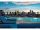 Rooftop pool featuring city views, lounge chairs, and a serene atmosphere, perfect for relaxation and enjoying the skyline at 1750 Wewatta St # 704, Denver, CO 80202